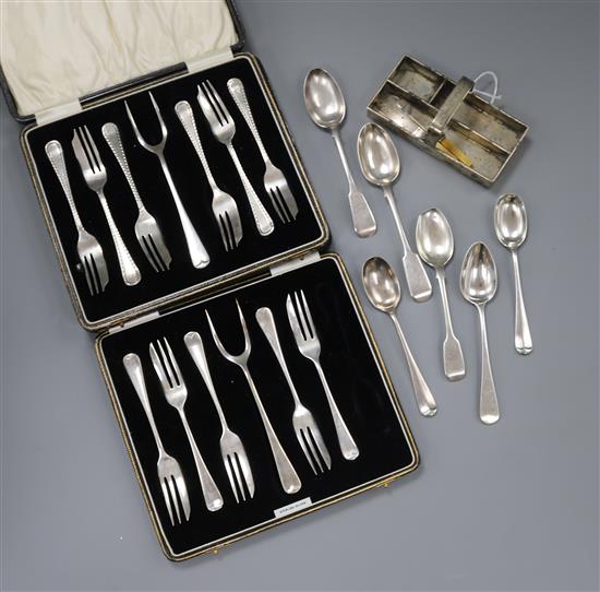 A miniature silver cutlery tray with two small knives and flatware including two cased sets of silver pastry forks (one incomplete).